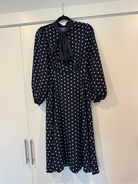 NWOT Navy polka dot dress with tie bow on neckline and balloon 3/4 sleeves